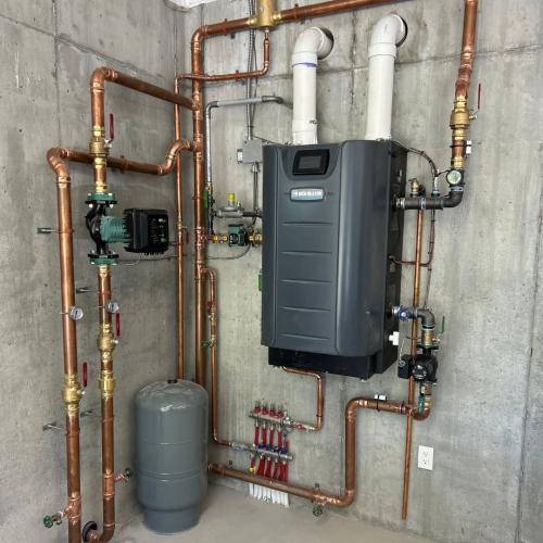 High-efficiency wall mounted boiler installation by Patton Heating and Air.