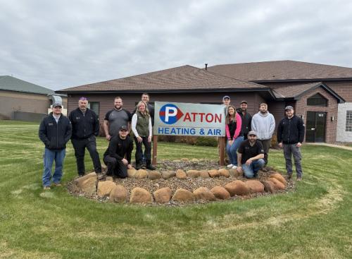 Patton Heating & Air's East Bethel, MN team posing in a group photo, showcasing the local HVAC crew known for professional installations and 24-hour residential and commercial service.
